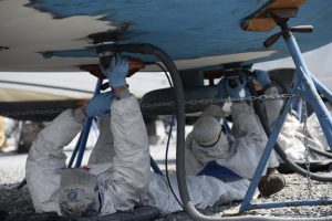 staff sanding boat